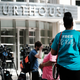 Supporters of R. Kelly gather in front of a Brooklyn courthouse as jury deliberations in the federal trial against the performer continue on September 27, 2021 in New York City.
